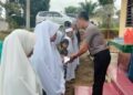 Senyum Anak Yatim Jadi Energi Pengabdian Personel Polsek Saipar Dolok Hole